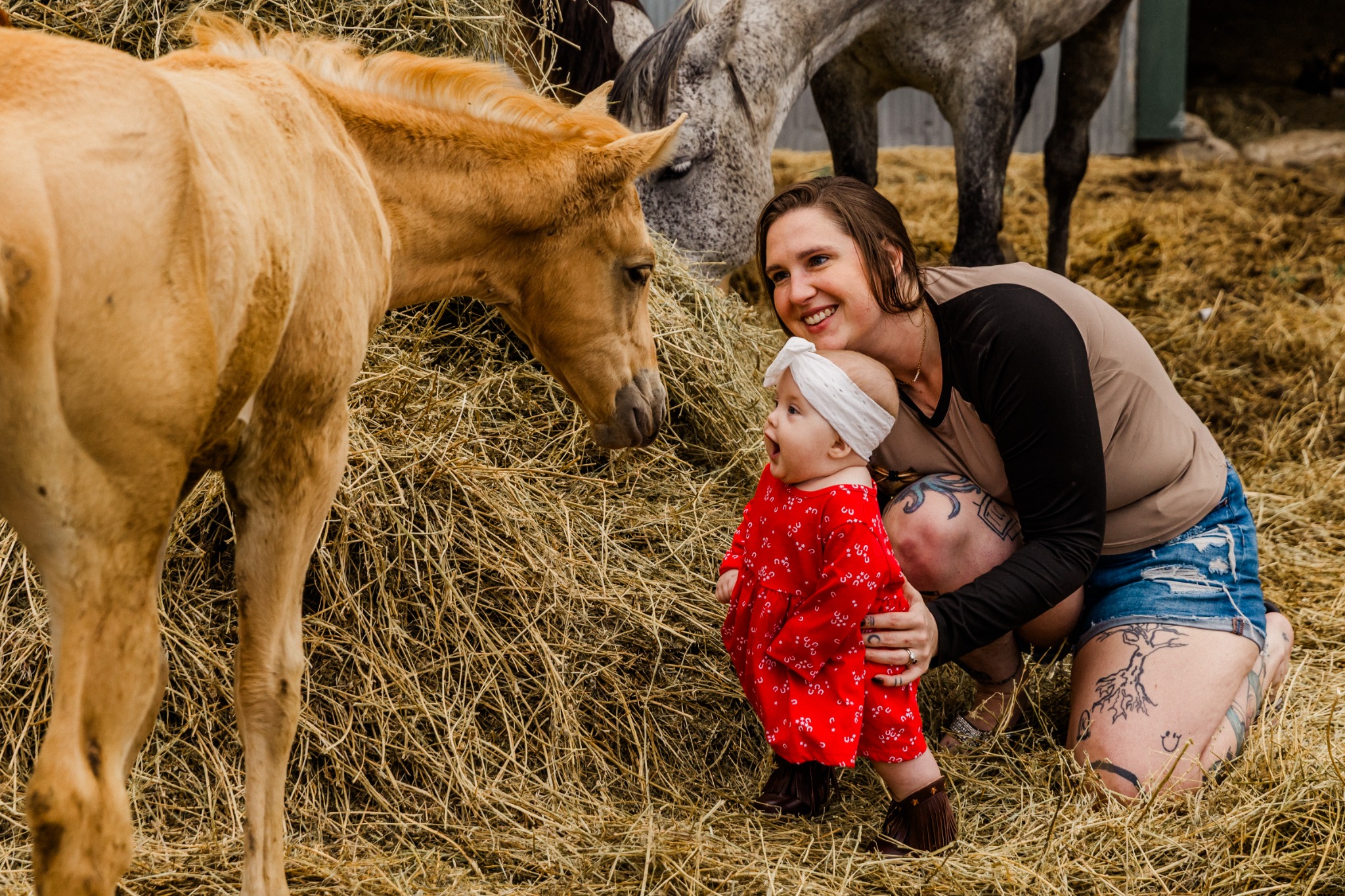 Kylie Miner with her daughter Lenora and horses at Miner Ranch
